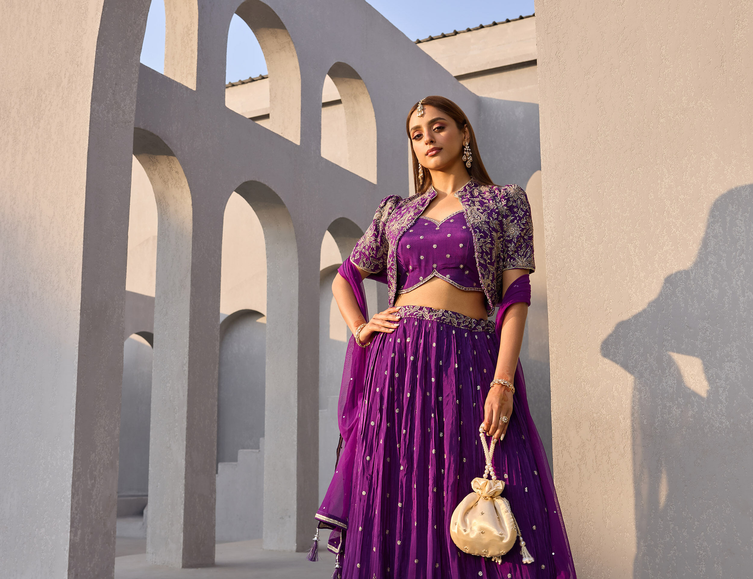 Woman wearing a stylish blue Indian suit for a festive occasion